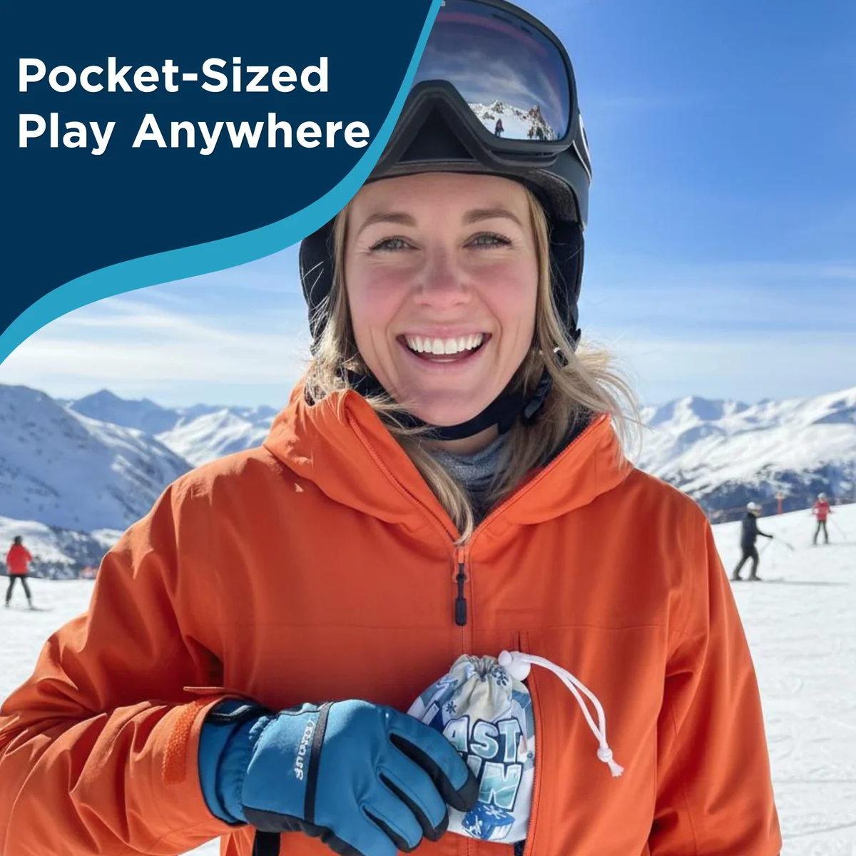 Skier on the slopes holding the Last Run travel pouch